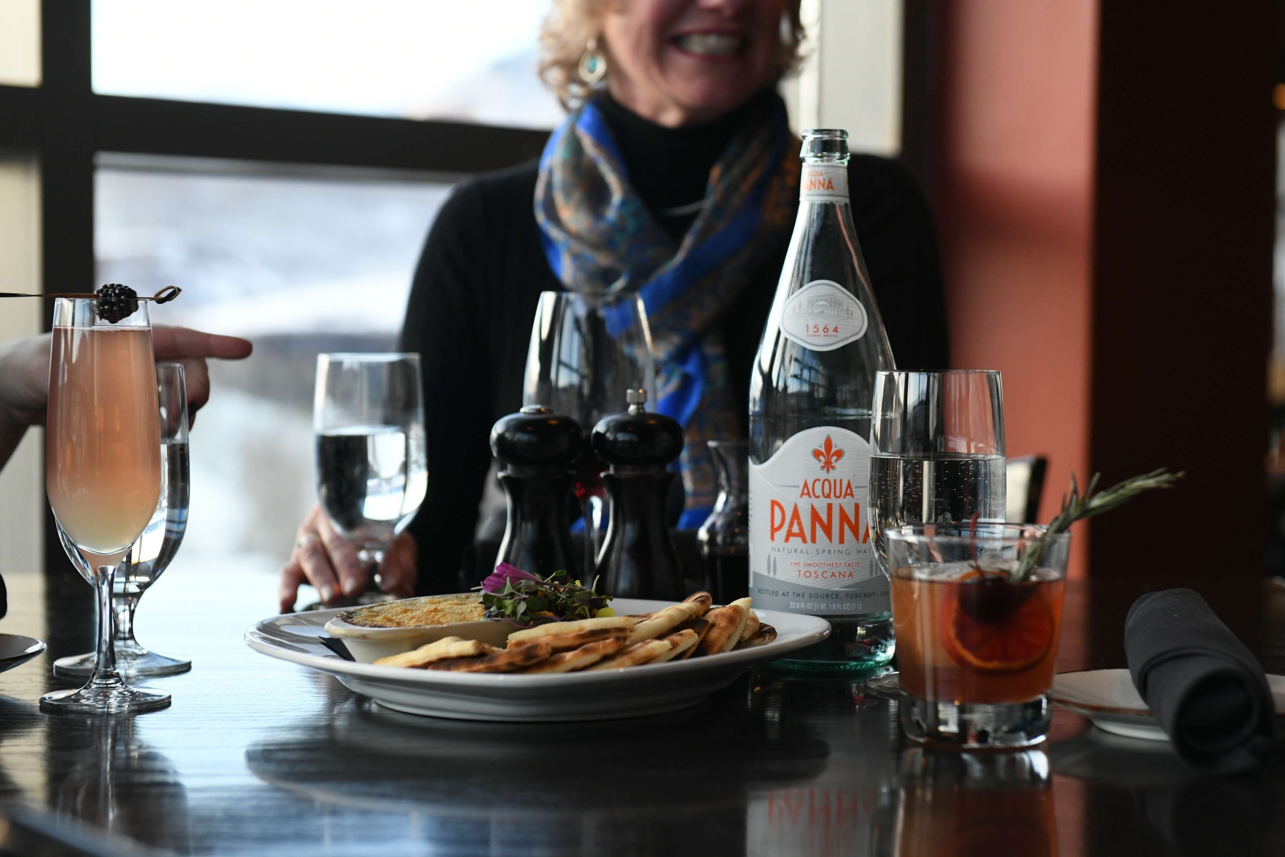 A woman enjoying one of the best restaurants in Telluride.