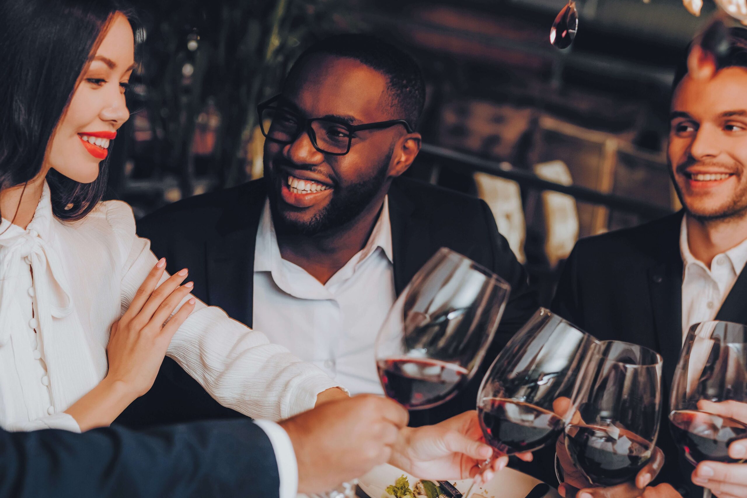 A woman and two men enjoying Restaurants in Telluride.